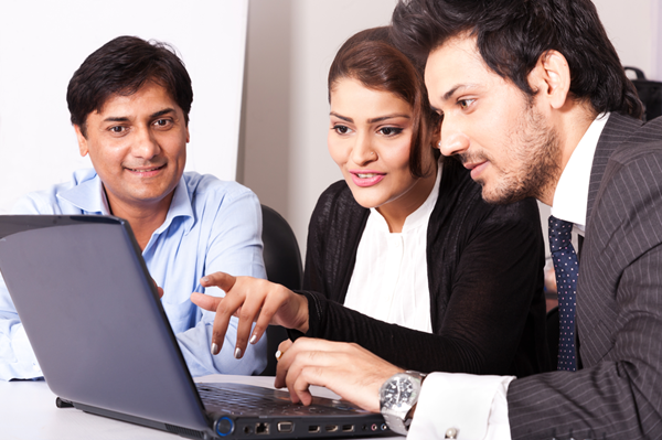 people-looking-at-laptop-screen-image-from-shutterstock